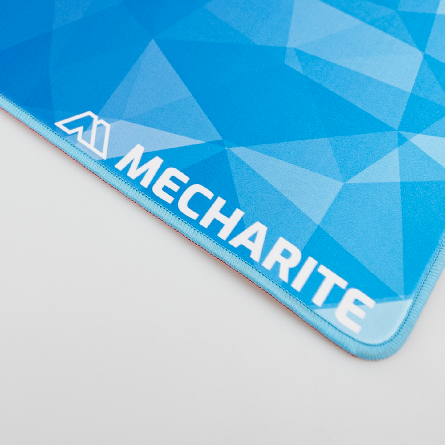 MECHARITE - Musemåtte XL - BLUE EDITION Logo